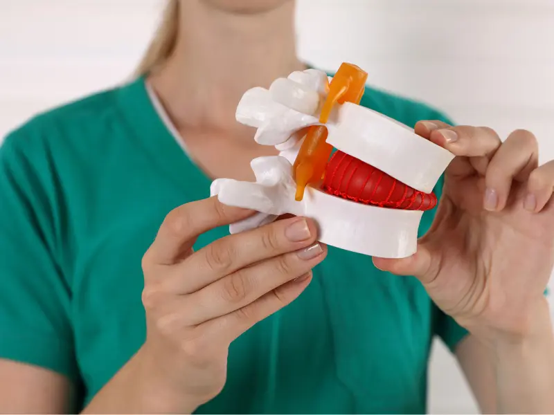 Disc Injury Treatment Near Me in Pace and Milton, FL. Chiropractic Exam For Disc Injury Pain Relief.